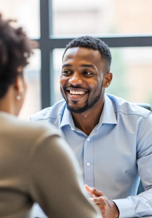 Smiling professional during team performance meeting